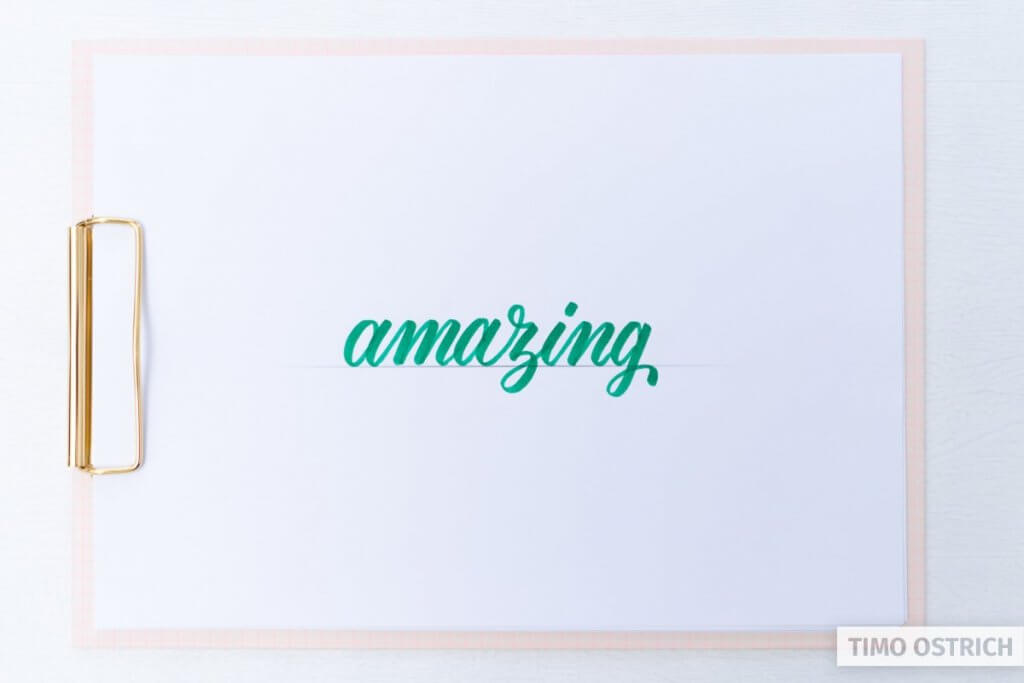 Brush lettering the word amazing